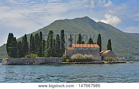 The tiny St George's Island in Kotor Bay Montenegro also known as the Island of the Dead. The island contains a 12th century Benedictine abbey and a cemetery.