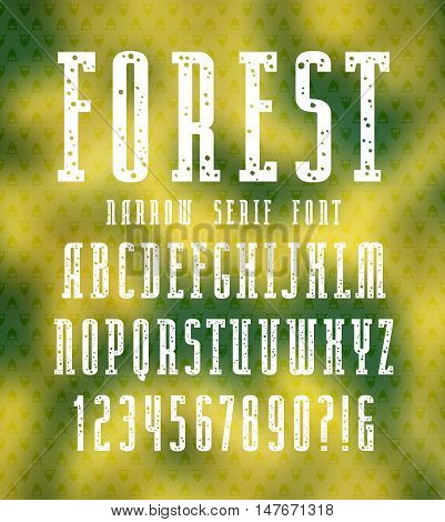 Narrow serif font with speckled texture. Bold face. White print on blurred background