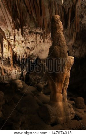 A human-like stalagmite in the cave at Postojna
