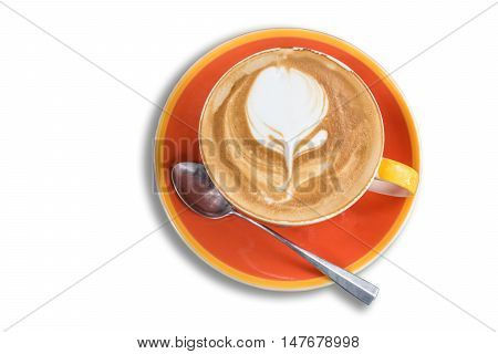 Empty orange mug of coffee latte on vintage wooden table