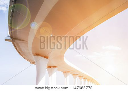 Underside of an elevated roads with lens flare effect