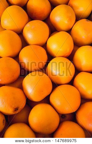Bunch of fresh tangerines oranges on market