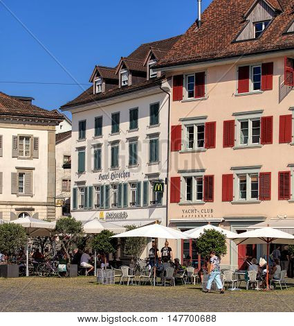 Rapperswil, Switzerland - September 12, 2016: historic buildings on Fischmarktplatz square. Rapperswil is a part of the municipality of Rapperswil-Jona in the Swiss canton of St. Gallen, located on the east side of Lake Zurich.