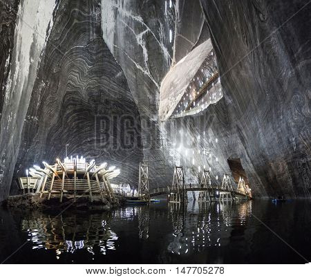 TURDA, ROMANIA - SEPTEMBER 15, 2016. Underground salt mine in Turda ,popular attraction for many tourists,Transylvania, Romania.