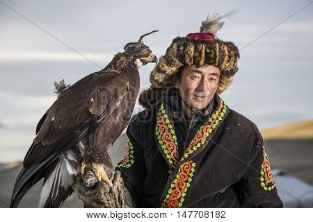 Bayan Ulgii Mongolia September 30th 2015: Portrait of a Mongolian eagle hunter with his eagle
