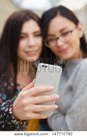 Girl Taking Selfie On Smart Mobile Phone With Dual Camera