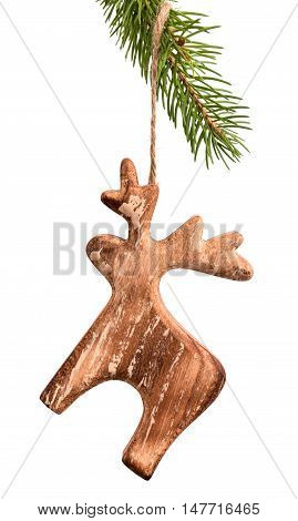 Christmas wooden moose decoration hanging on fir-tree branch isolated on white