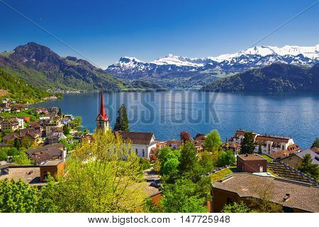 Panorama image of village Weggis lake Lucerne (Vierwaldstatersee) Pilatus mountain and Swiss Alps in the background near famous Lucerne (Luzern) city Switzerland