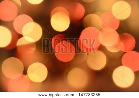 Bright christmas eve background. Plenty of golden sparkling bokeh from defocused garland lights. Backdrop for design