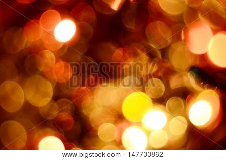 Bright christmas eve background. Plenty of golden sparkling bokeh from defocused garland lights. Backdrop for design
