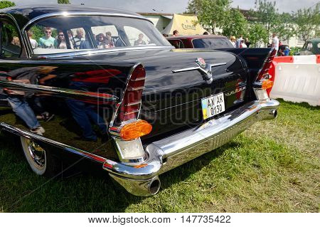 Kharkiv Ukraine - May 22 2016: Tail fin and rear lights of Soviet retro car black GAZ-13 Chayka manufactured between 1959 and 1981 is presented at the festival of vintage cars Kharkiv Retro Rally - 2016 in Kharkiv Ukraine on May 22 2016