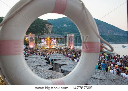 BUDV- JULY 18 : CROWD IN FRONT OF THE DANCE PARADISO STAGE MORNING SESSION AT BEACH AT SEA DANCE FESTIVAL 2015 MUSIC FESTIVAL JULY 18 2015 IN BUDVA JAZ BEACH MONTENEGRO