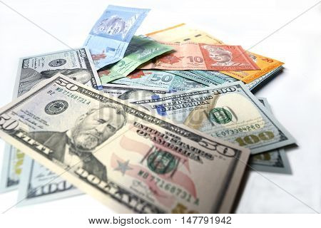 Malaysian ringgit and United States Dollar on a white background