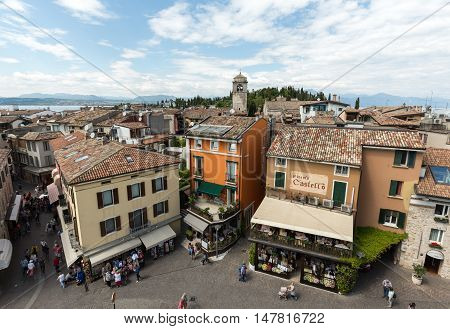 SIRMIONE ITALY - MAY 5, 2016: View of Piazza Catello from the Scaliger Castle in Sirmione Lake Garda Italy