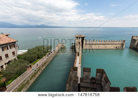 SIRMIONE ITALY - MAY 5, 2016: Backwater inside the Scaliger Castle - medieval port fortress Sirmione Italy