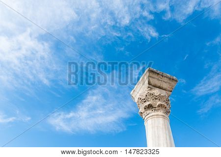 The column in the Ancient city Chersonese, on a bluesky background. Ruins of Basilica 1935 VI-X c. , Sevastopol, Crimea Russia. Free space for text.