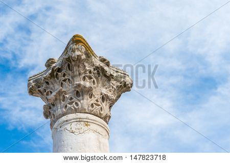 The column in the Ancient city Chersonese, on a bluesky background. Ruins of Basilica 1935 VI-X c. , Sevastopol, Crimea Russia. Free space for text.