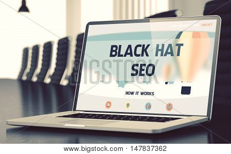 Closeup Black Hat SEO Concept on Landing Page of Laptop Screen in Modern Meeting Room. Toned Image. Selective Focus. 3D Illustration.