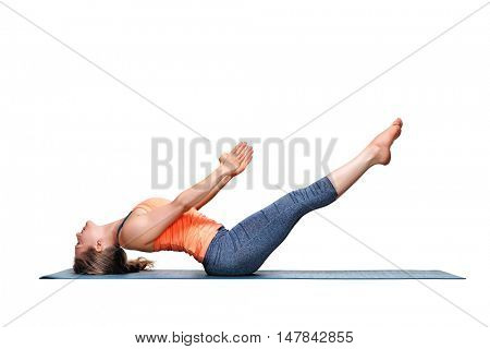 Beautiful sporty fit woman practices Ashtanga Vinyasa Yoga asana Uttana padasana - raised legs pose isolated on white