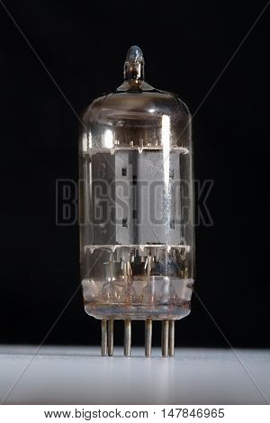 Preamplifier vacuum tube against dark background