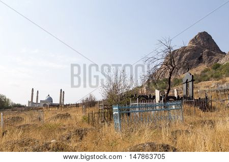 Osh, Kyrgyzstan - October 05, 2014: A traditional muslim cemetery at the foot of Solomons Hill
