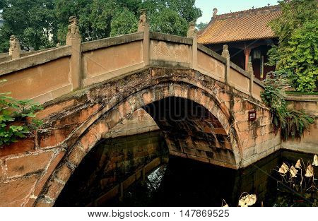 Deyang China - Nobember 5 2009: One of three Pan Bridges spanning the Pan Pond with the Dacheng Gate on the right at historic Deyang Confucian Temple