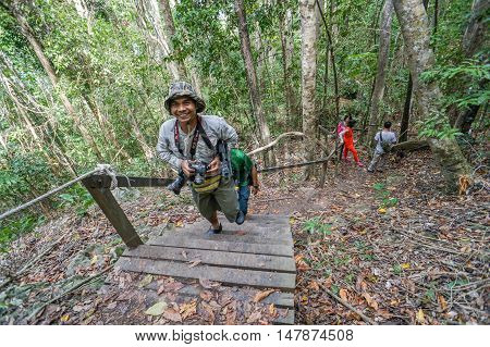 Semporna,Sabah-Sep 10,2016:A group of friends hike up a trail in Bohey Dulang,Tun Sakaran Marine Park,Semporna,Sabah,Borneo.It is the most popular island for hiking & climbing activities.