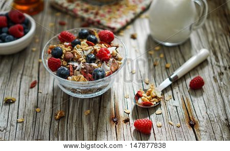 Healthy Coconut Granola with Nuts, Gogi Berry and Berries. Healthy breakfast. Selective focus.