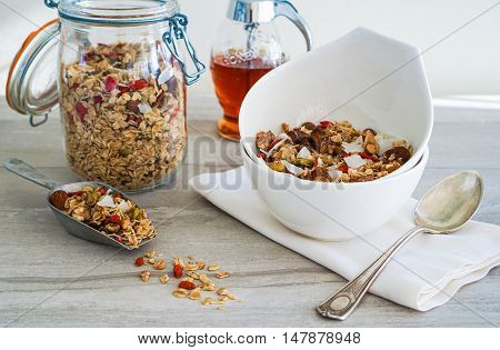 Healthy Coconut Granola with Nuts, Gogi Berry and Honey. Healthy breakfast. Selective focus.