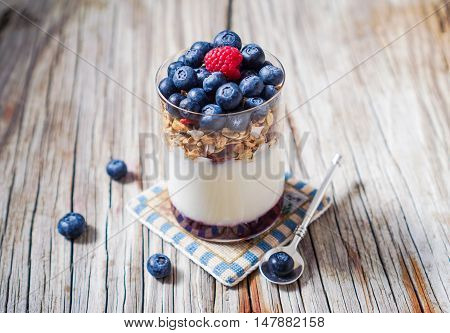 Healthy Yogurt Parfait and Granola with Nuts and Berries. Healthy breakfast. Selective focus.