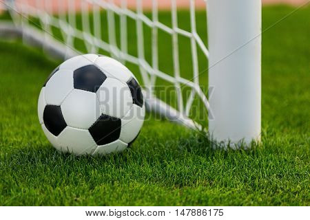 Closeup of a Soccer Ball and Goalpost