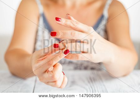 Woman Is Taking Off The Ring From Hand
