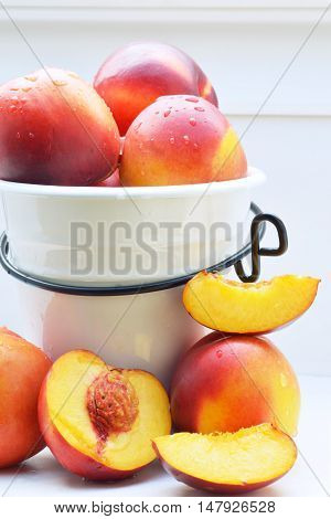 fresh colorful nectarines in and arround a pot