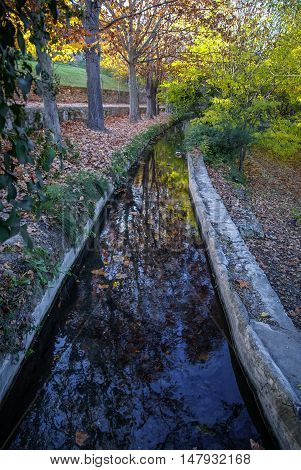 Autumn Landscape With Colorful Leaves, River And Reflections In Water