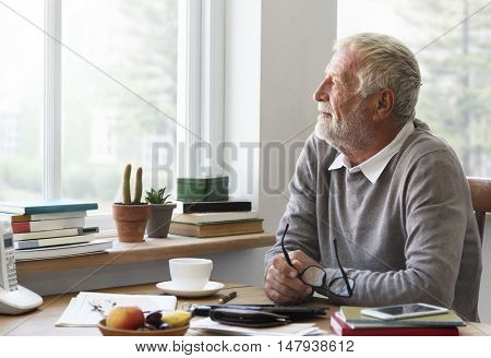 Senior Adult Looking Outside WIndow Relax Concept