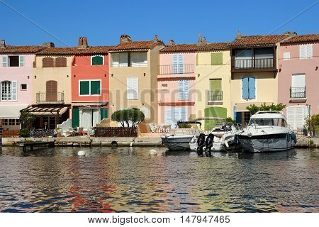 Pretty pastel colored houses on the waterfront in Port Grimaud in France