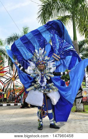 Tenggarong Indonesia - October 27th 2012: carnival with unique costumes on public roads within distance 4 km and is held every year in east borneo indonesia