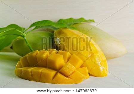 Mango Nicely Cut With Leaf On Wooden Background (also Known As Horse Mango, Mangifera Foetida, Anaca