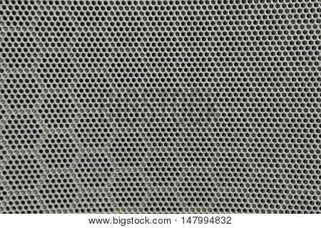 Closeup surface of black metal loudspeaker at the door of car textured background