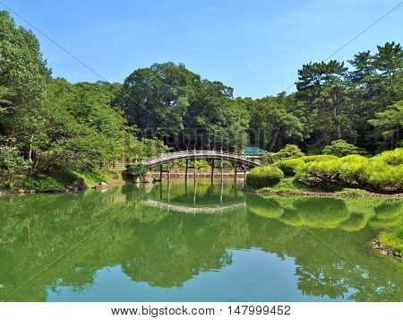 A wooden bridge - Engetsukyo in Ritsurin Garden in Takamatsu city, Kagawa Prefecture, Japan. Ritsurin Garden is one of the most famous historical gardens in Japan.
