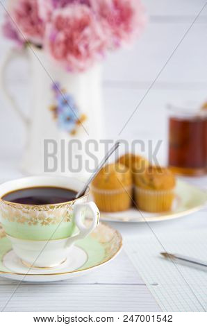 Morning Coffee And Muffins On A White Table