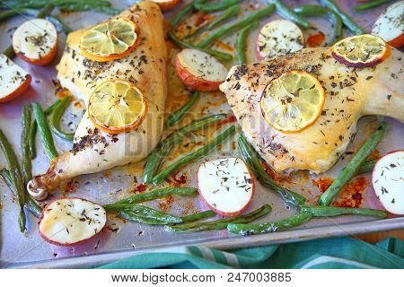 Potatoes, Green Beans And Chicken Quarters Baked On A Sheet Pan