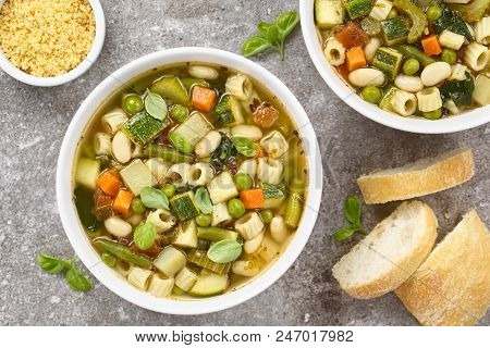 Fresh Homemade Vegetable Soup Made Of Zucchini, Celery, Carrot, Peas, White Beans, Green Beans, Pota