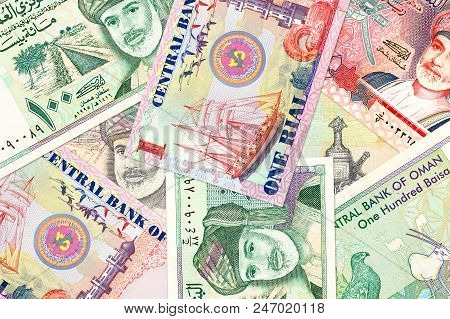 Some Omani Rial Bank Notes Mixed On A Table
