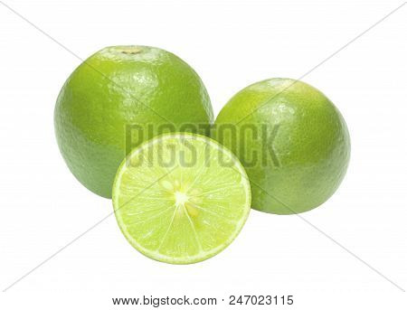 Half of lime citrus fruit (lime cut) isolated on white background. Sliced lime half with clipping pa
