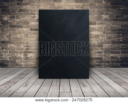 Blank Black Fabric Canvas Frame At Grunge Brick Wall And Wood Plank Floor,mock Up Template For Addin