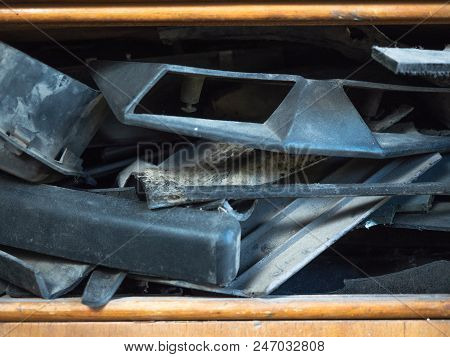 Close Up View On Dusty Motor Vehicle Parts Laying On Brown Shelf Of Wooden Box. Different Spare Car 