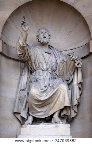 PARIS, FRANCE - JANUARY 04: Saint Peter the Apostle, statue on the portal of the Saint Sulpice Church, Paris, France on January 04, 2018.