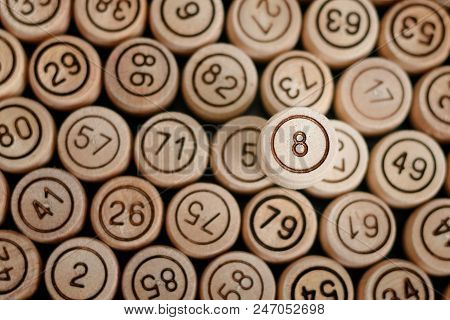 Lucky Number 8 On The Background Of Wooden Keg Lotto. Close Up