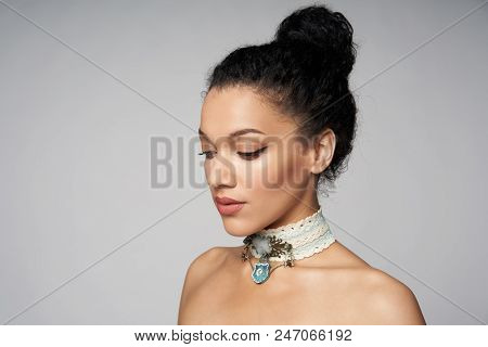 Beauty Closeup Portrait Of Beautiful Mixed Race Woman Wearing Chocker Posing, Isolated On Gray Backg